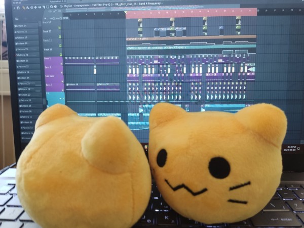2 blobcat plushies, one facing at the screen and one away from it, sitting on a laptop's keyboard with an FL Studio project open
