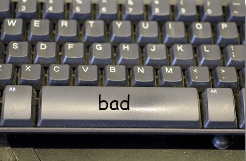 a space bar with the word "bad" written over it