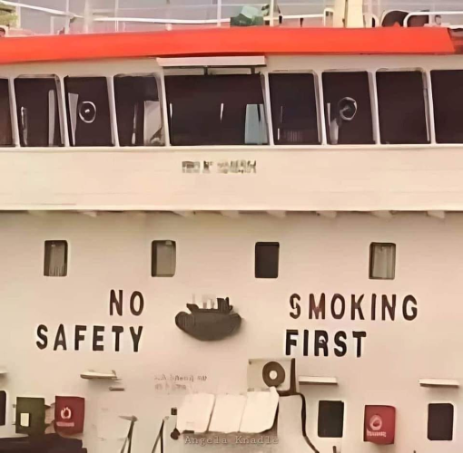 sign that can be either  read as "no smoking/safety first" or "no safety/smoking first"