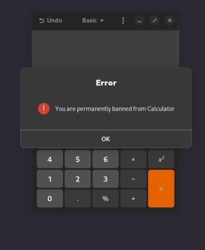 The image displays a calculator application interface with a dark background. At the top, there are options labeled 'Undo' and 'Basic' with a menu icon next to them. Below this, there is a large, bold text that reads 'Error'. Underneath the error message, there is a warning icon followed by a message stating 'You are permanently banned from Calculator'. Below this message, there is a button labeled 'OK'. The calculator itself shows a numeric keypad with numbers 0-9, a decimal point, and a percentage symbol. There are also operation keys such as addition (+), subtraction (-), multiplication (x), division (÷), and an equal sign (=). The 'x' and '÷' keys are highlighted in orange, possibly indicating they are the current operation.
